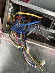 Technician servicing electric strip heat components in Grants Pass, OR.