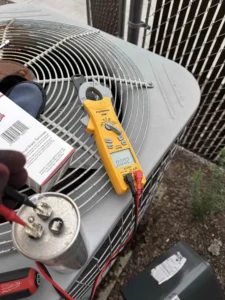 Grants Pass air conditioner repair technician evaluating electrical components for buzzing