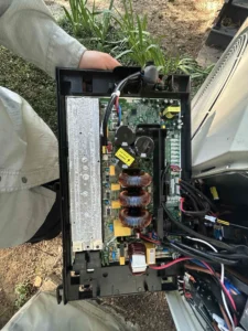 Grants Pass air conditioner repair technician evaluating electrical components after AC system failure